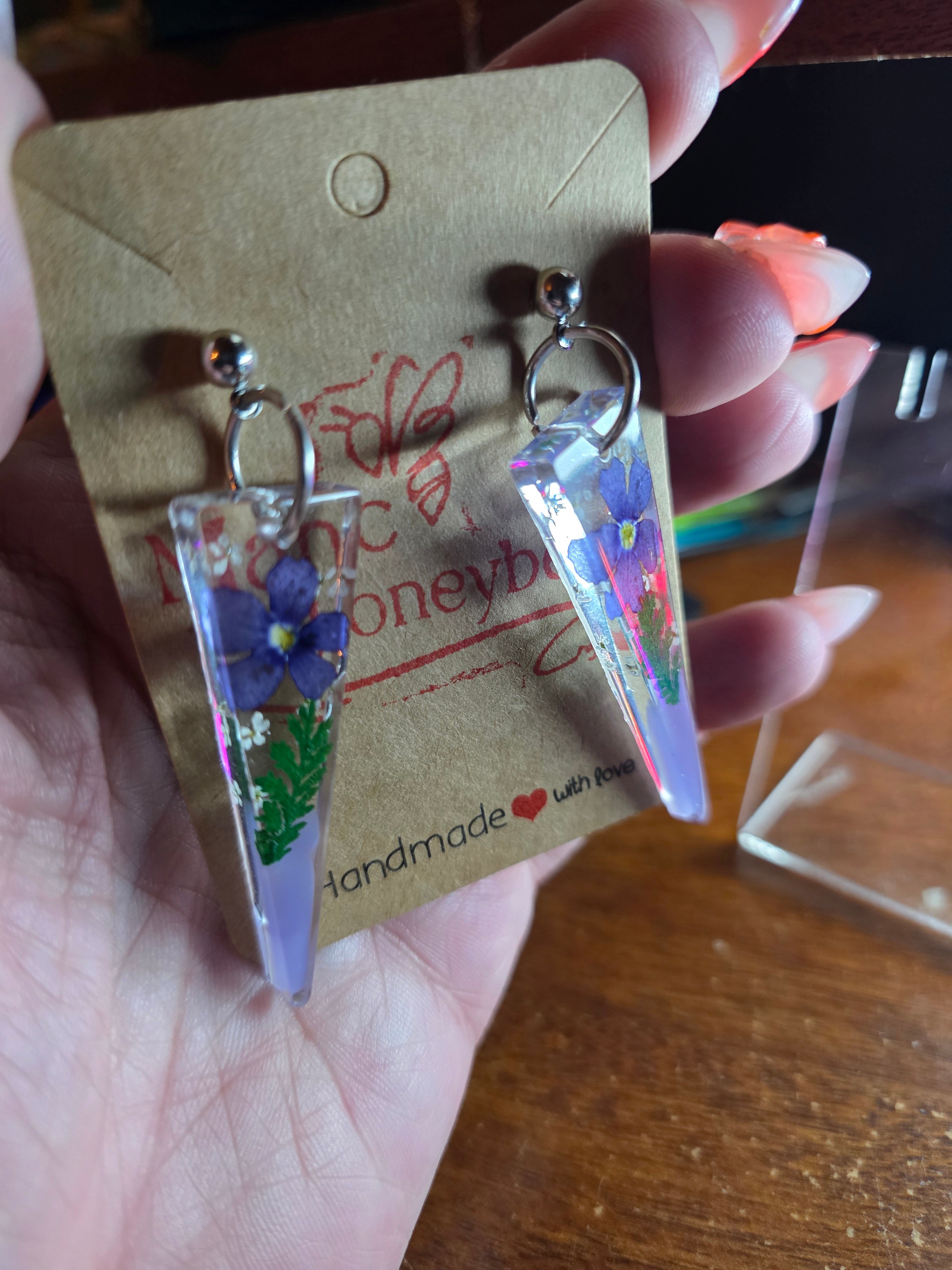 Floral elongated triangle resin earring dangle in purple