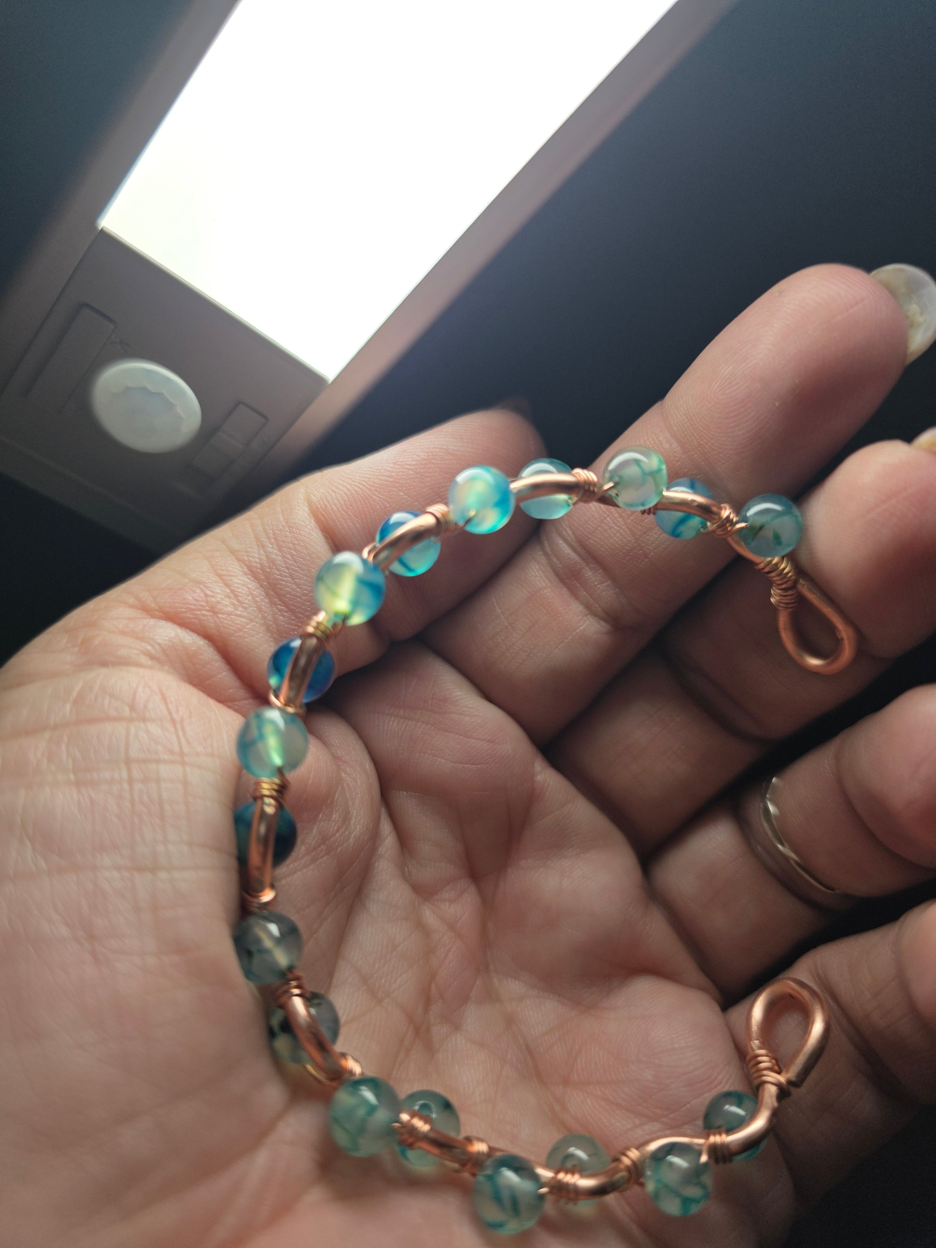 Dragon glass and copper hand wrapped wire bracelet