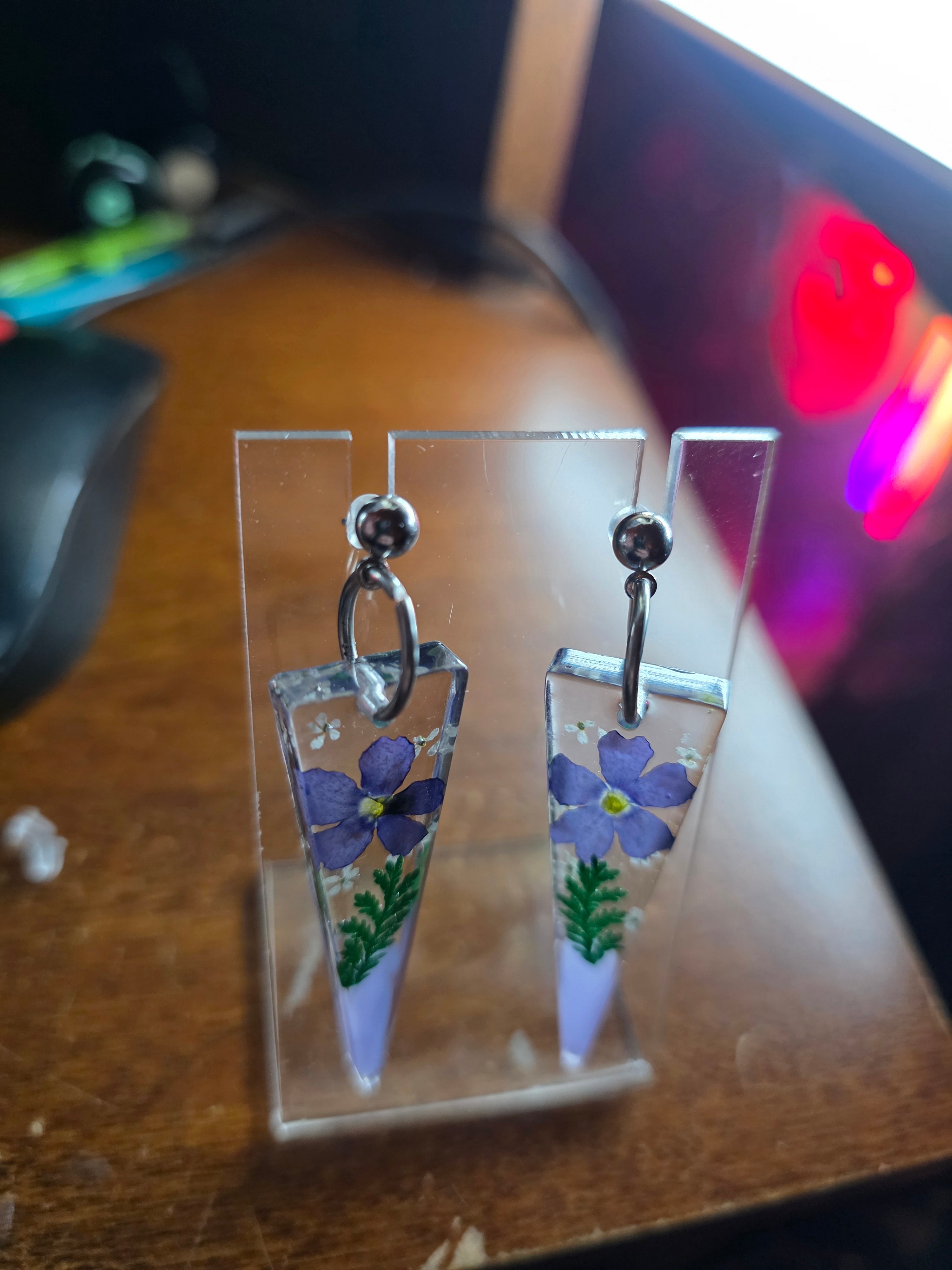 Floral elongated triangle resin earring dangle in purple